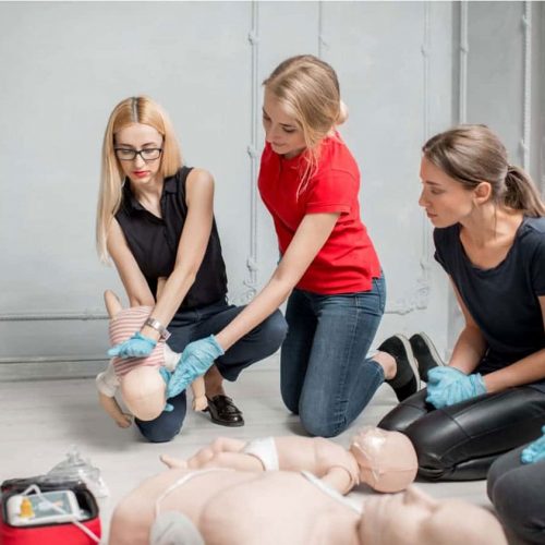 Instructor and students in a first aid training