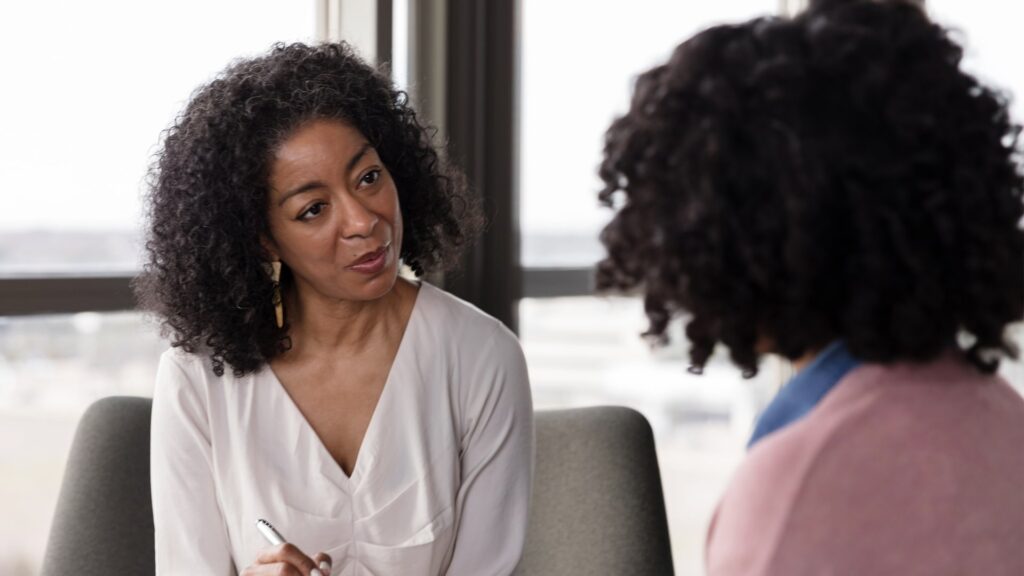 psychologist talking to a patient