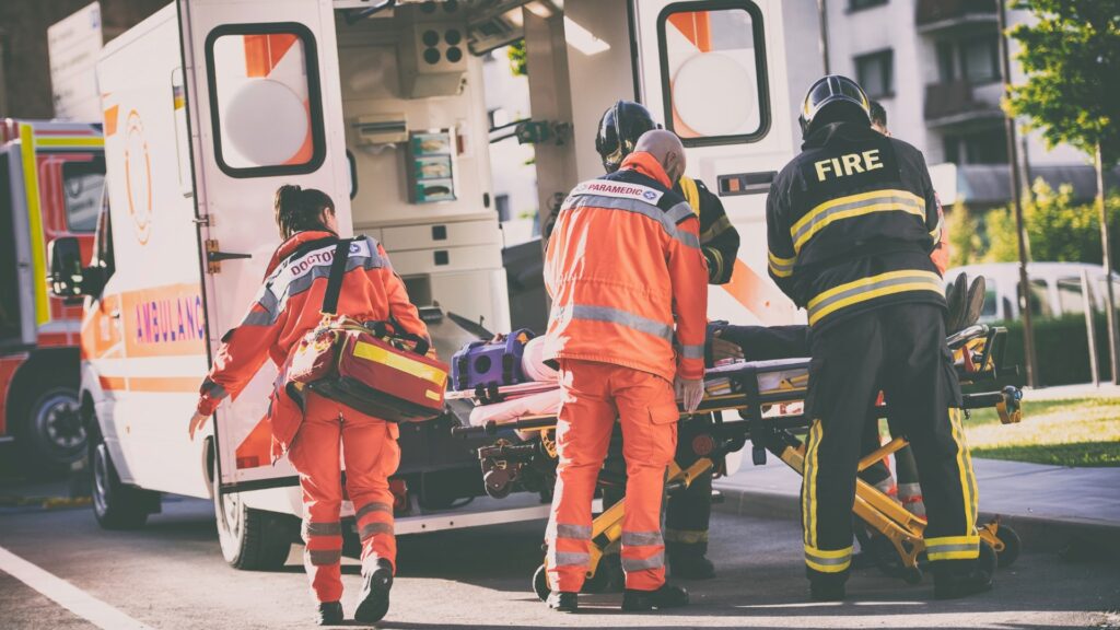 First Responders loading a patient into an ambulance