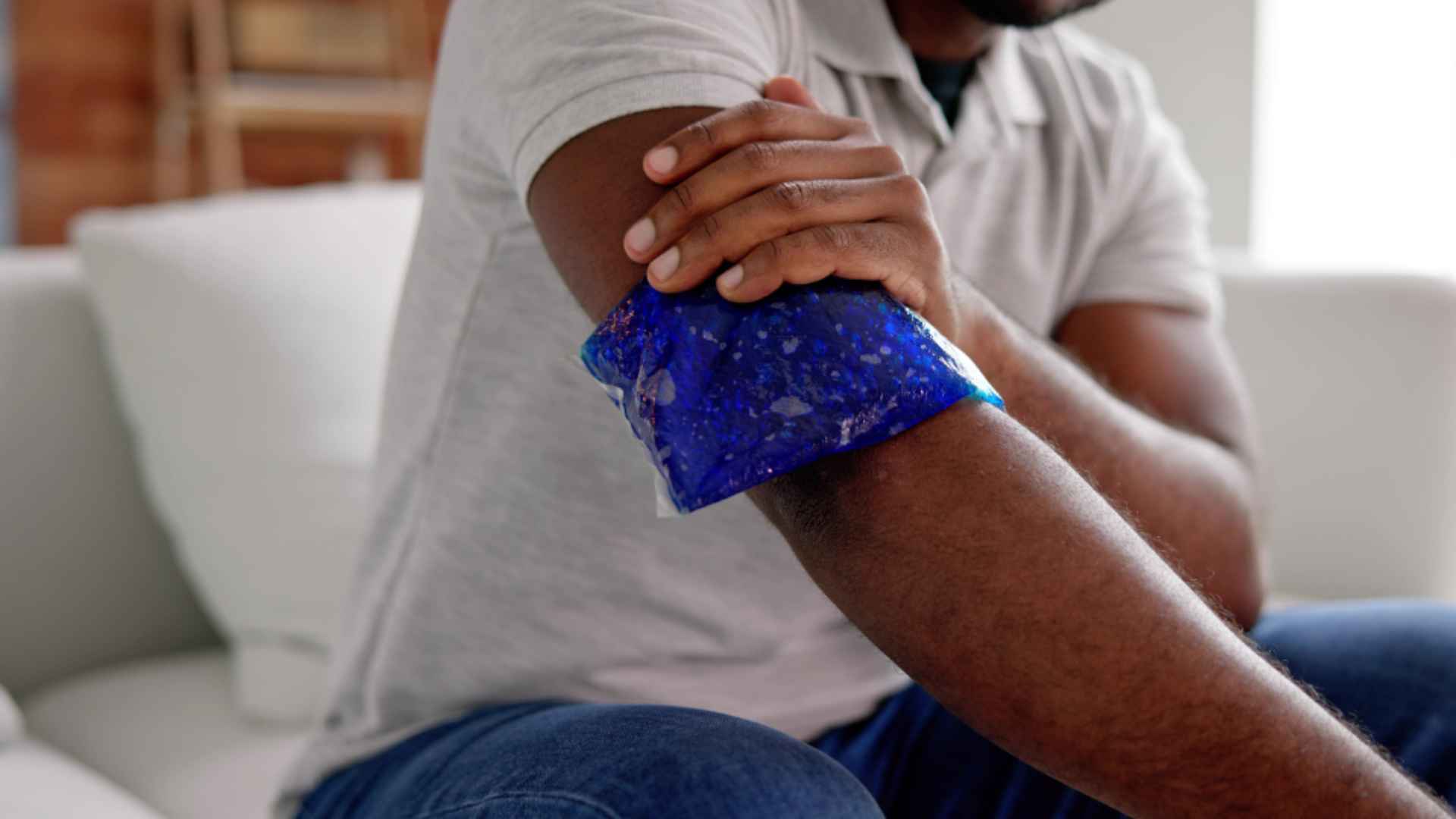 A person applying ice to a broken bone.