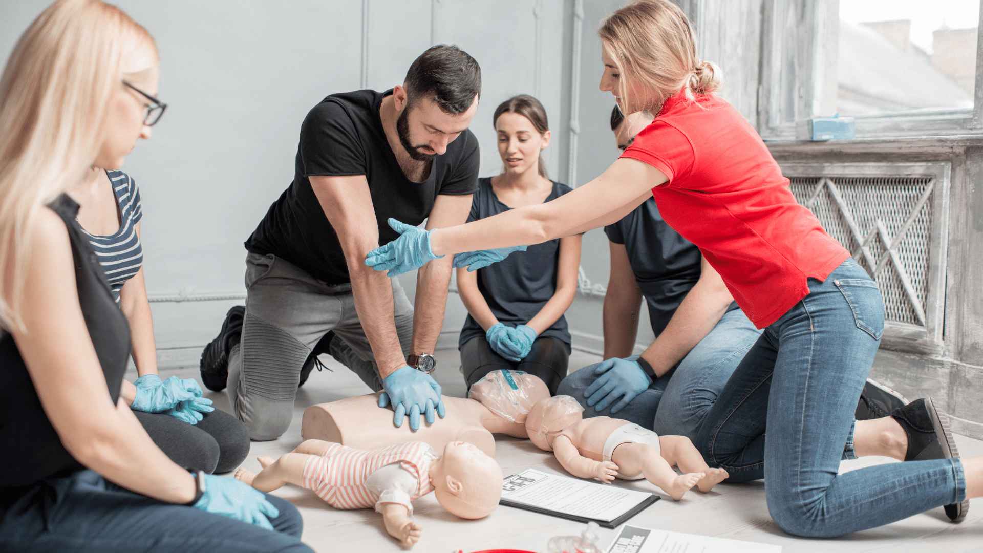 Group of people undergoing first aid training.