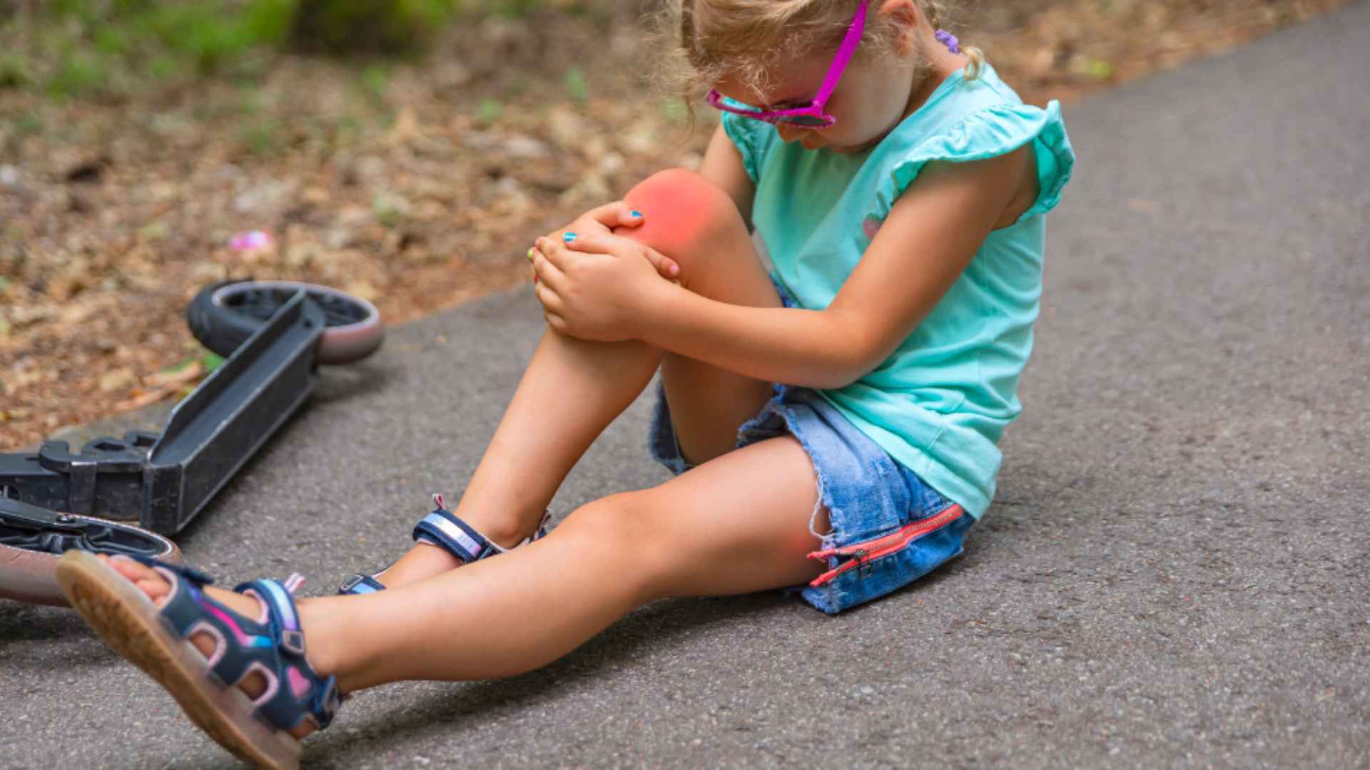 A child injured by falling from her scooter