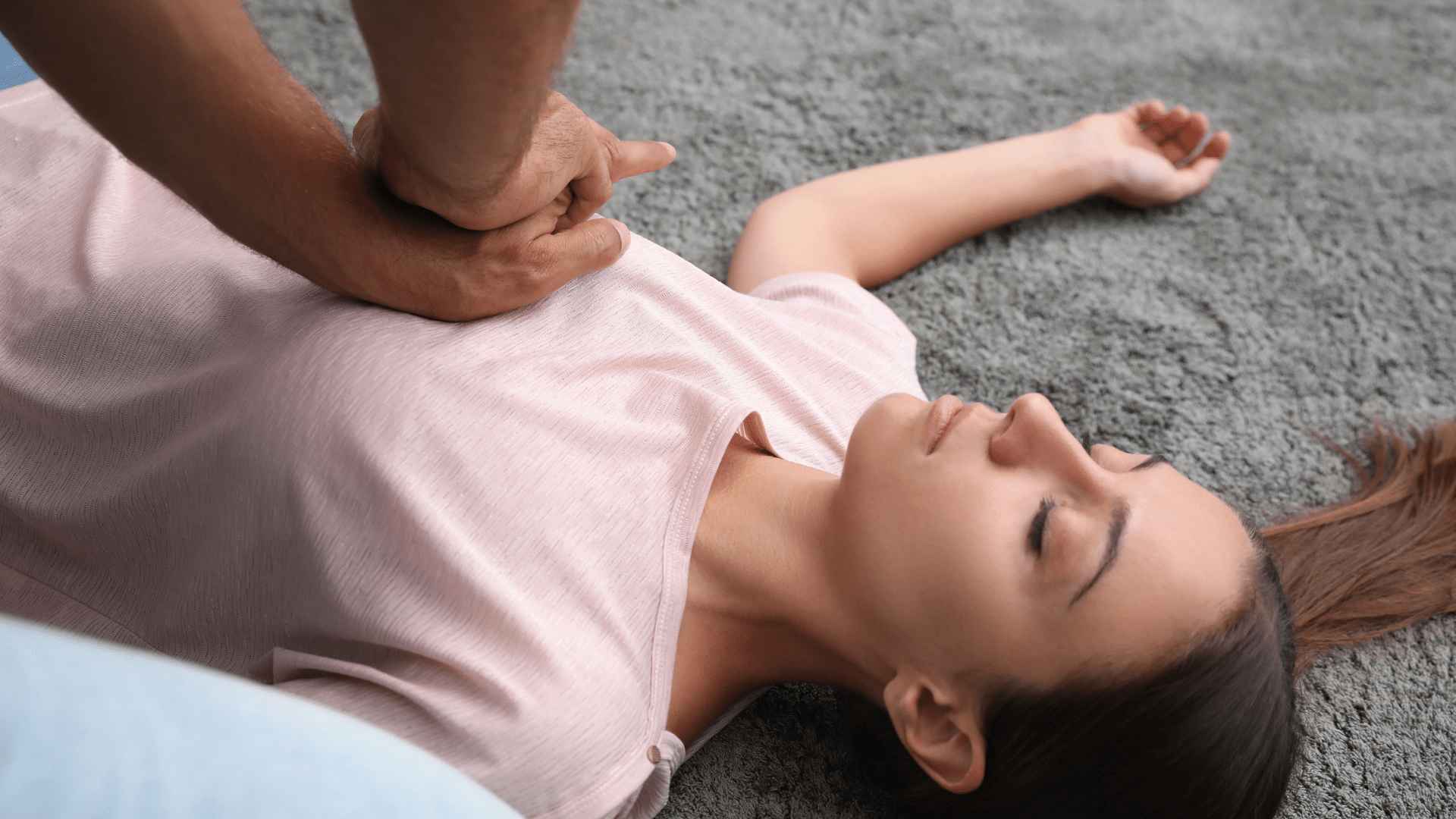 Administering CPR on a woman