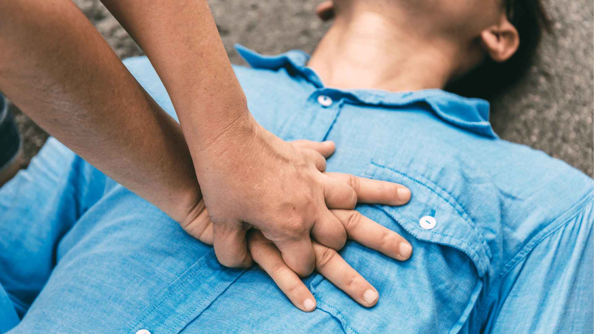 Person performing chest compressions on another person