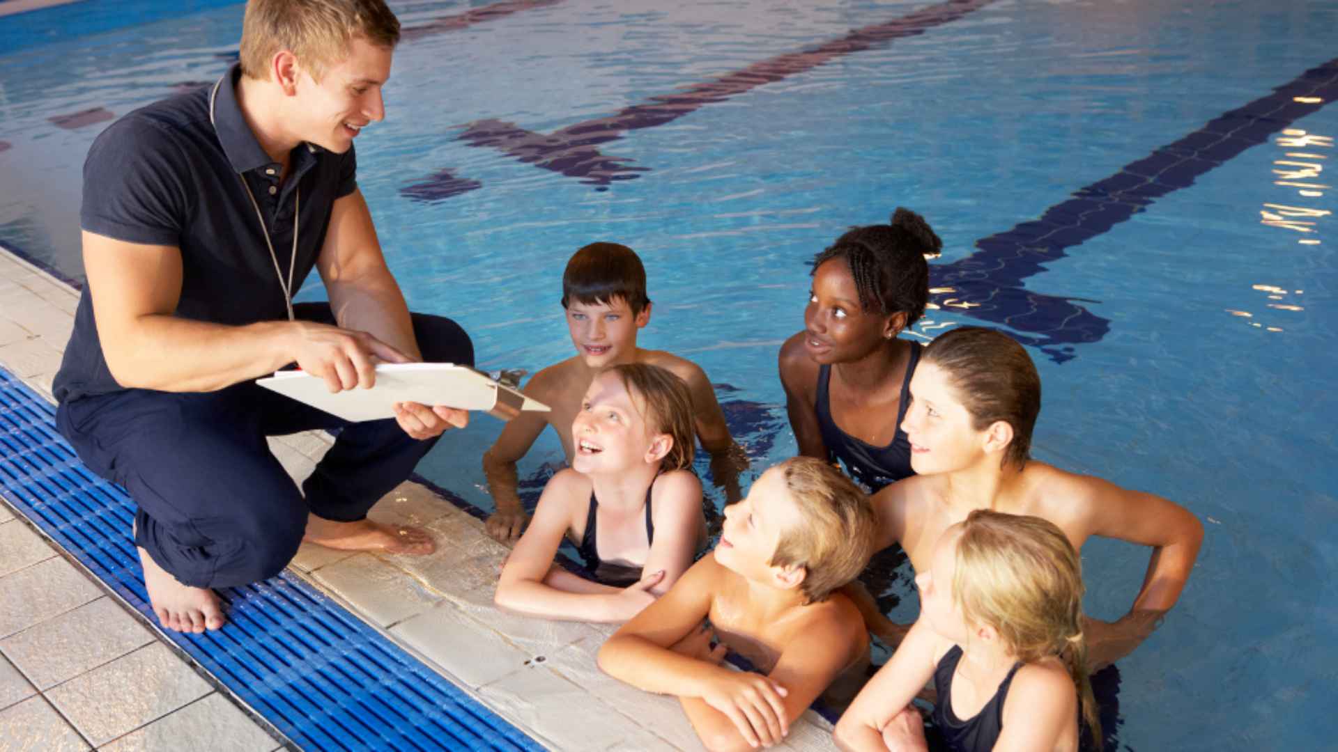 A group of kids taking swimming lessons from Coast2Coast