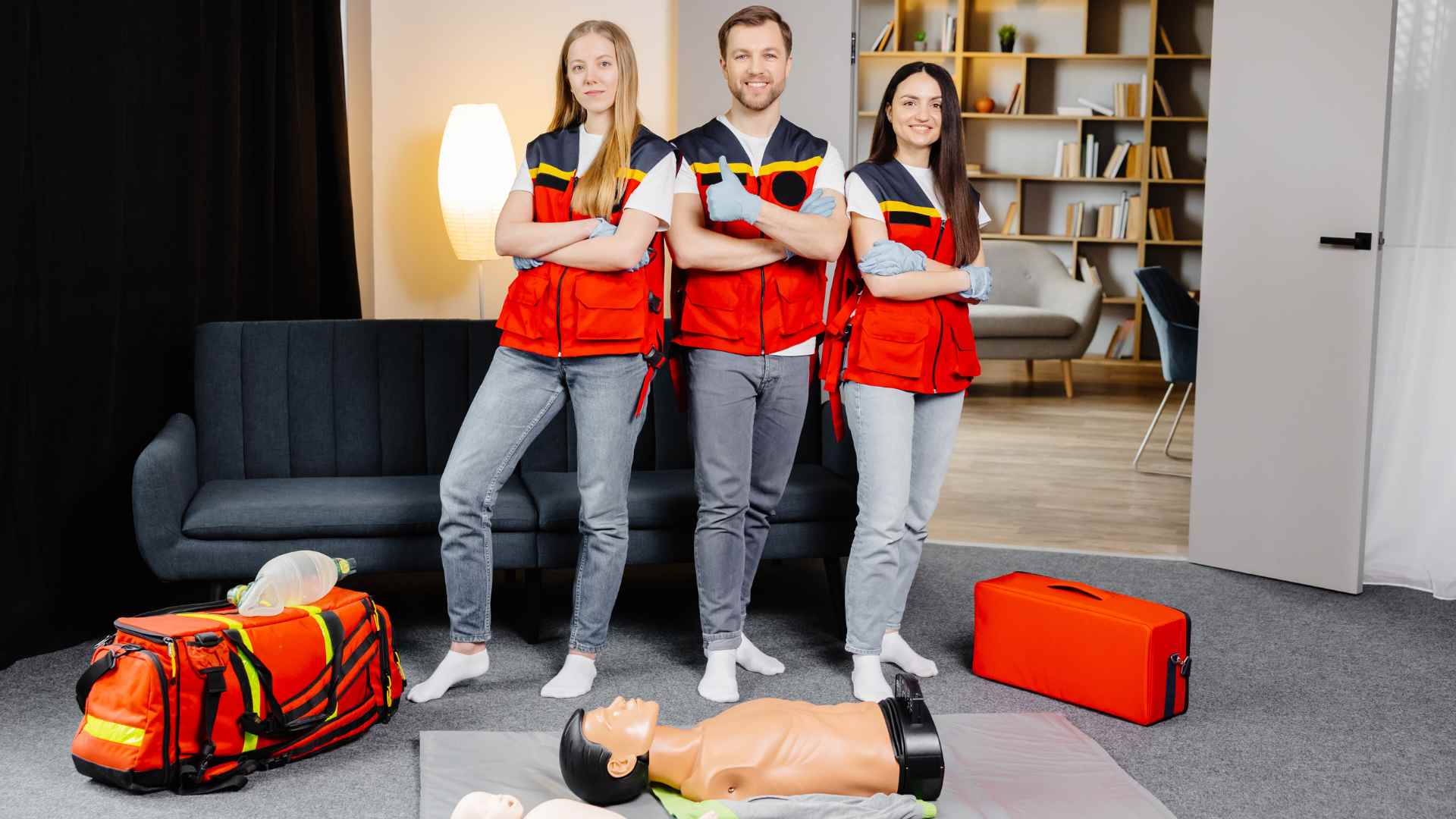 Three employees confident after completing their workplace first aid training.