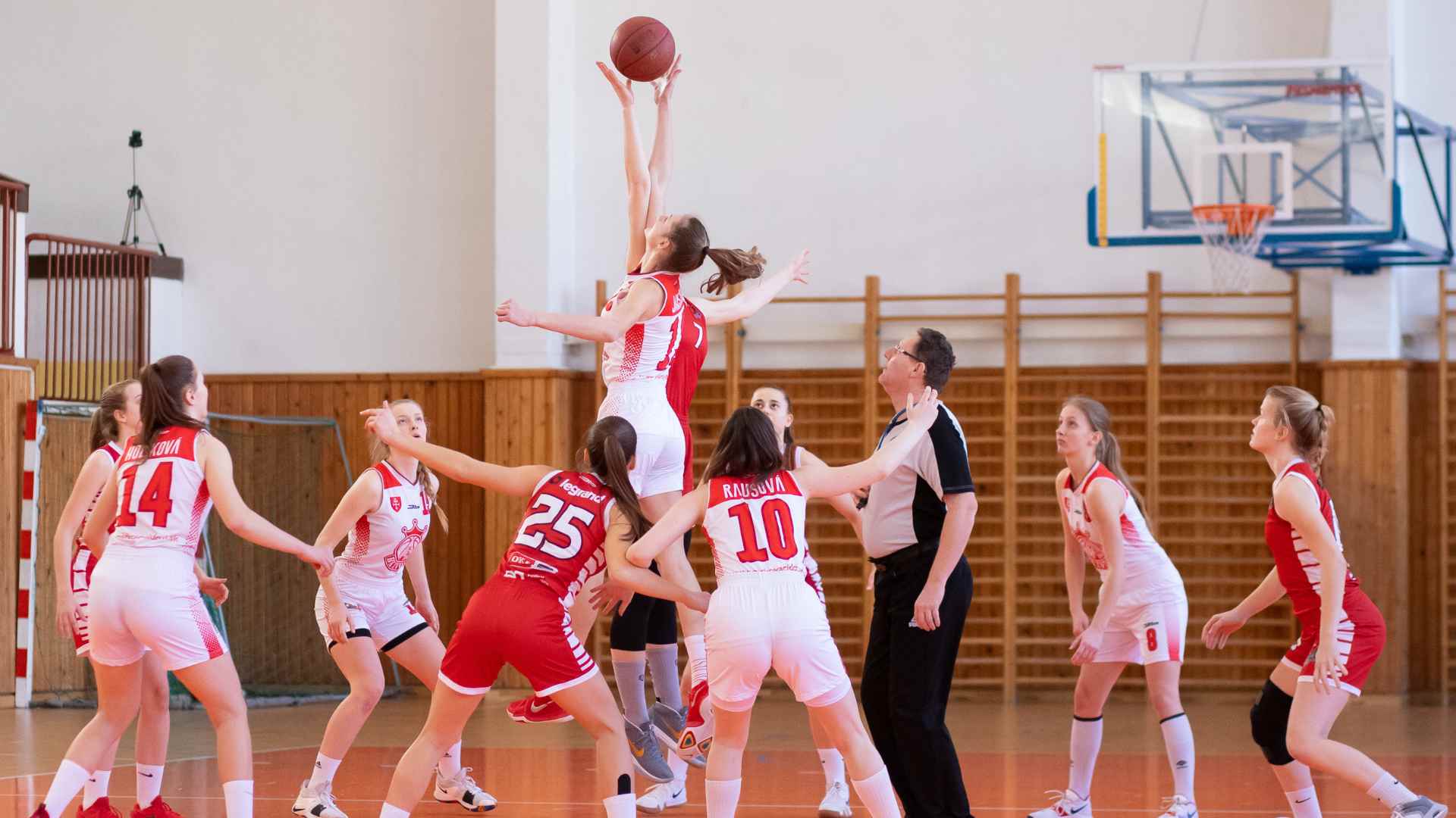 A group of fit and fine basketball players in a court.