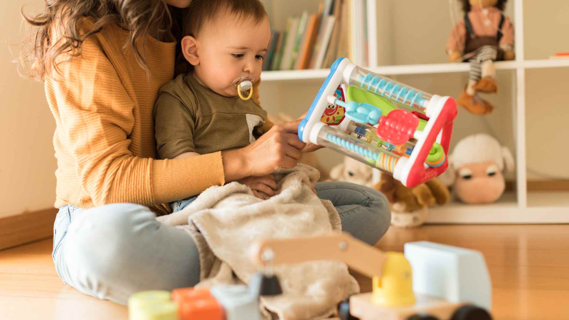 A mother bonding with his infant by playing games .