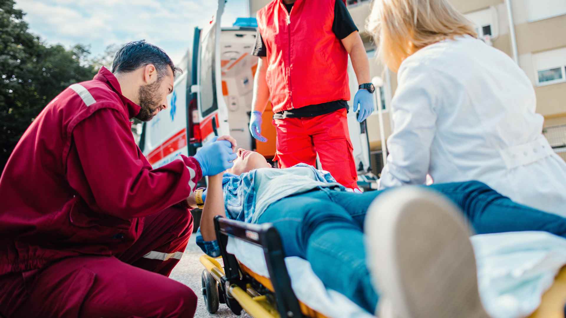 Medical professionals helping an injured person.