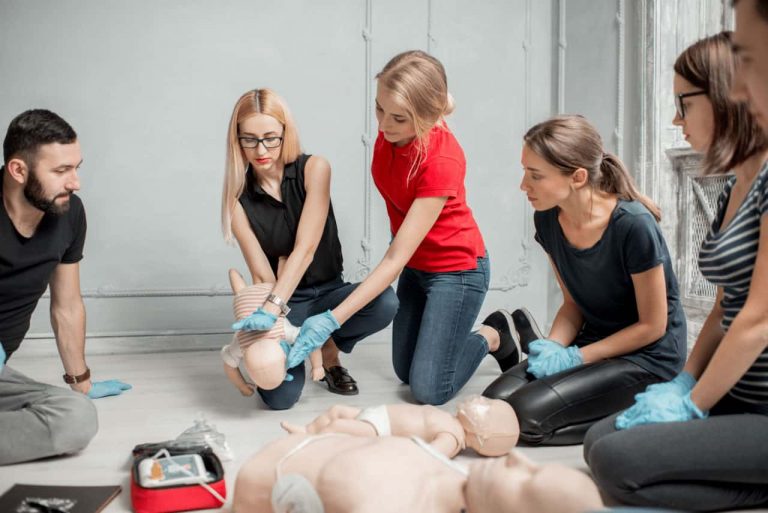 People in a private first aid training