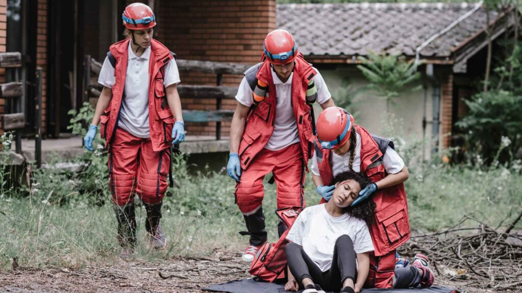 First responder assisting a victim in a natural disaster