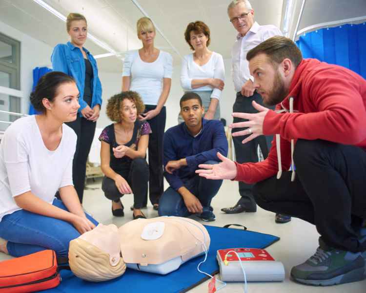 group of students learning cpr