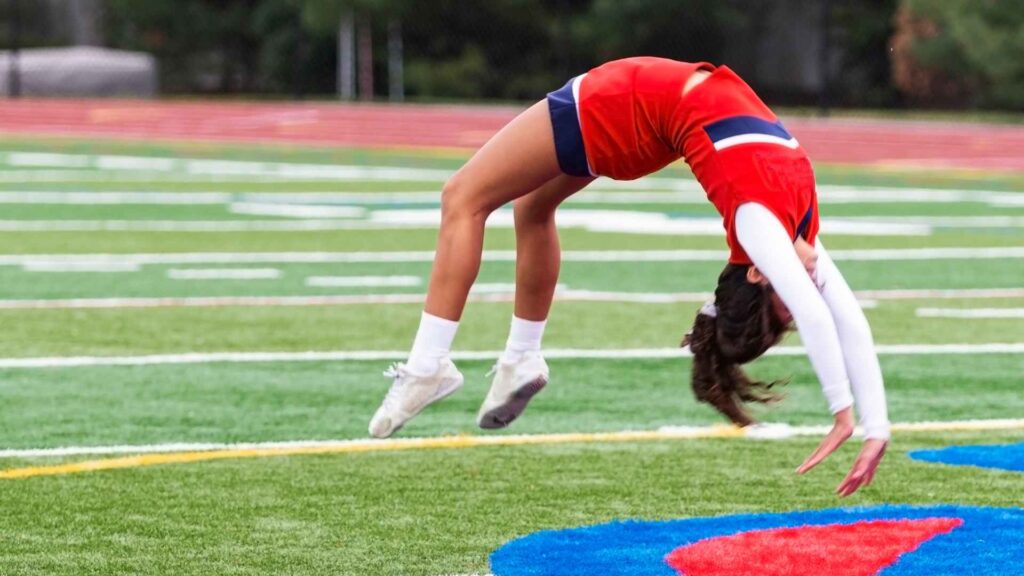 a cheerleader doing a backflip